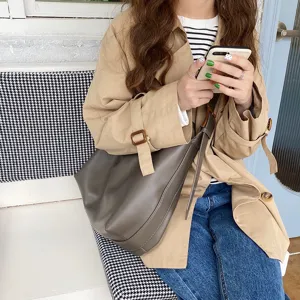 Minimalist soft leather hobo bag for women, large capacity shoulder bag shown on model's body.
