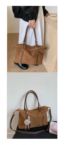 Close-up lifestyle view of a large vintage brown suede bowling bag with gold hardware detail