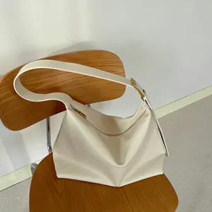 Minimalist off-white soft leather hobo bag with large capacity and adjustable strap