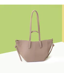 Side view of a vintage taupe wing-shaped tote bag featuring long straps and knots