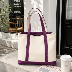 Large capacity women's canvas tote bag in cream and purple, perfect for casual daily use.
