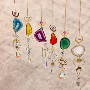 Detailed macro view of vibrant natural agate slice and crystal prism suncatcher ornaments
