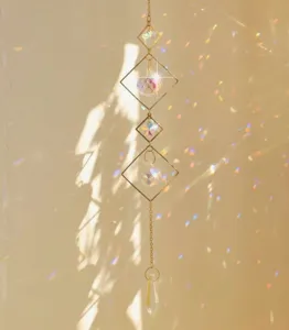Detail of geometric square crystal suncatcher creating rainbow light reflections