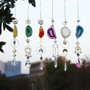 Close-up of colorful agate slice sun catchers with crystal prisms and golden metal charms