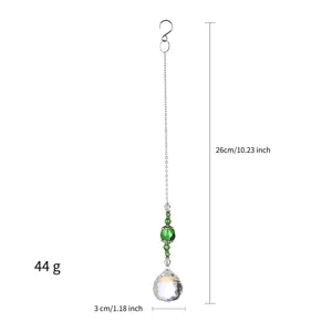 Close-up detail of green crystal suncatcher ornament showing 26cm length and weight