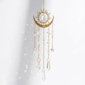Close-up of golden flame moon crystal sun catcher with beautiful prism light reflections