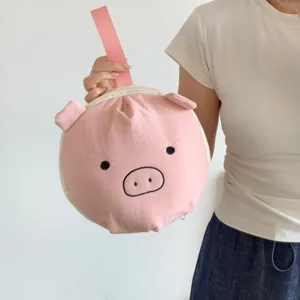 Organizador de viaje rosa con forma de cerdito para lencería y objetos pequeños