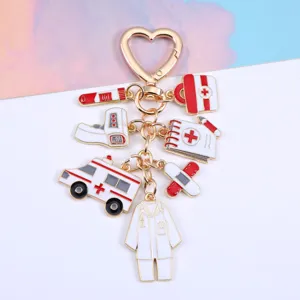 Detailed view of a zinc alloy medical keychain with ambulance and thermometer charms