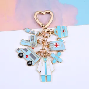 Medical themed zinc alloy keychain with ambulance, doctor coat and syringe charms