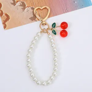 Sweet cherry pendant and white pearl bead keychain charm with golden heart clasp