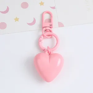 Detailed view of a candy-colored resin heart keychain pendant for bags and car keys