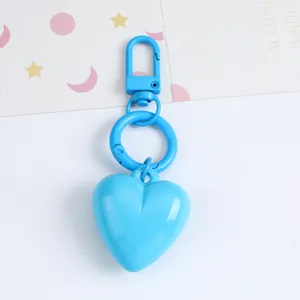 Detailed close-up of a sky blue candy-colored resin heart keychain decoration