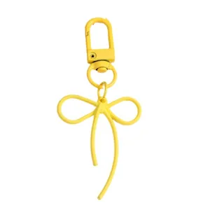 Vibrant yellow alloy bow keychain pendant for bags and phone cases DIY accessories