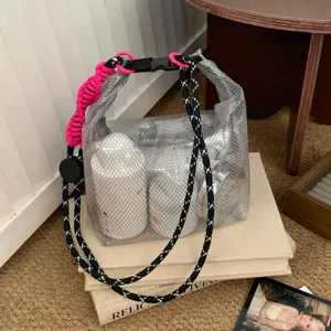 Close-up of large capacity EVA waterproof travel bag with mesh texture and buckle.
