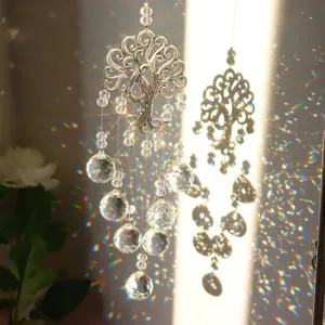 Tree of Life crystal suncatcher with rainbow prism reflections for window garden decor.