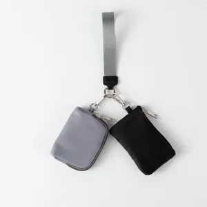 Minibolsos de muñeca portátiles para tarjetas y monedas de nailon resistente.