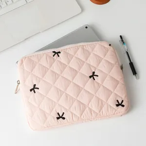 Professional view of a cute pink quilted laptop sleeve with black butterfly embroidery