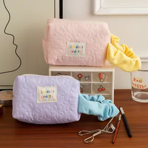 Floral quilted makeup bags in candy colors with matching hair scrunchies
