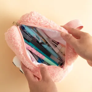 Detail macro view showing the large interior capacity of a soft fuzzy pink plush pencil case