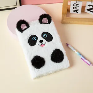 Detailed view of cute plush panda notebook with soft faux fur and embroidered features
