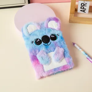 Detailed view of soft A5 plush notebook featuring a cute embroidered koala face design