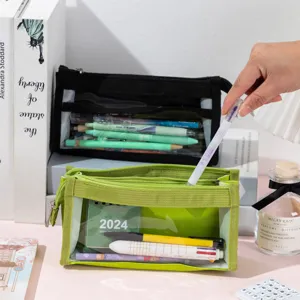 Close-up of lime green mesh pencil pouch showing transparent storage for pens and calendar.