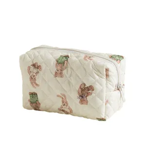 Quilted cotton cosmetic pouch with vintage bear pattern for travel organization