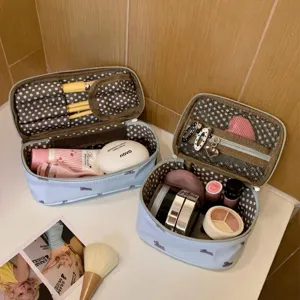 Detailed view of the dog-patterned makeup bag showing interior storage capacity and pockets