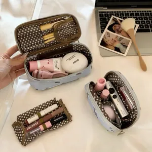 Detail showing multi-functional interior compartments and storage space of dog makeup bag