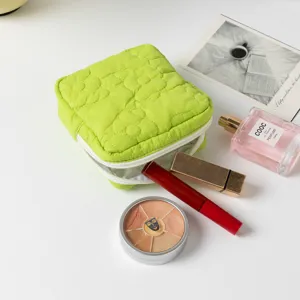 Quilted green cosmetic pouch with cute flower pattern for daily makeup essentials storage
