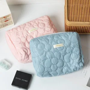 Floral quilted cosmetic storage bags in pink and blue pastel colors for travel