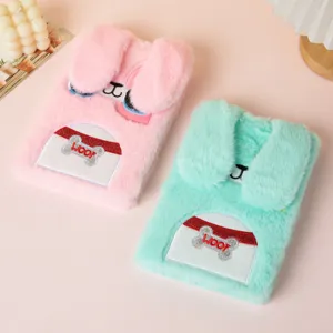Detailed macro view of cute plush cartoon rabbit diary notebooks with 3D ears in pink and green