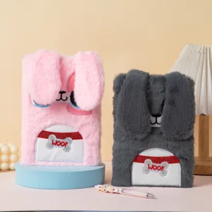 Detailed view of cute pink and grey plush rabbit notebooks with fluffy ears
