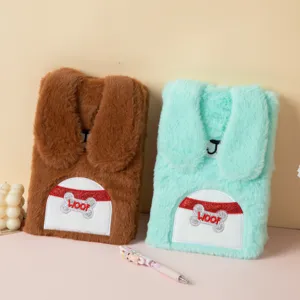 Detail of soft plush cartoon rabbit notebooks featuring embroidered WOOF design.