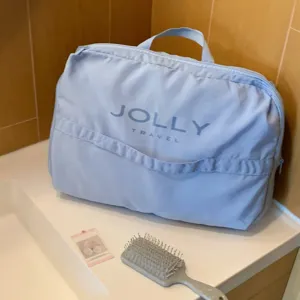 Bolsa organizadora JOLLY TRAVEL azul claro para equipaje y cuidado personal.