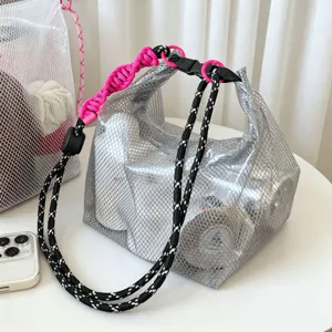 Detailed view of silver mesh EVA waterproof beach bag with pink braided handle strap