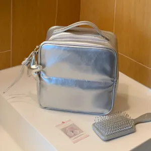 Large silver PU metallic cosmetic bag for travel storage with cute star charm detail