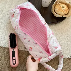 Large quilted hair tool storage bag with floral pattern and pink checkered lining
