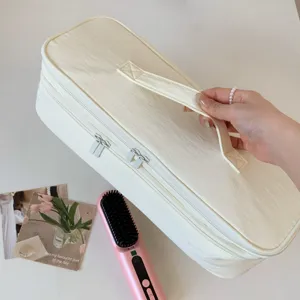 Detail view of cream double-layer portable storage bag for hair dryer and tools