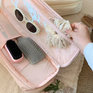 Interior view of the pink large capacity storage bag for hair tools and accessories