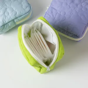 Detail showing interior of quilted flower storage bag for sanitary napkins and coins