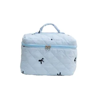 Large capacity light blue quilted makeup bag featuring delicate black embroidered bow patterns