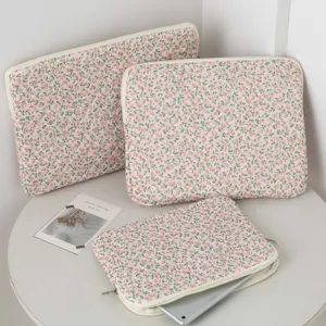 Floral quilted laptop sleeves in multiple sizes showing soft fabric detail