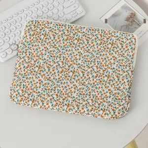 Detailed macro view of the fresh floral quilted pattern on this trendy laptop sleeve