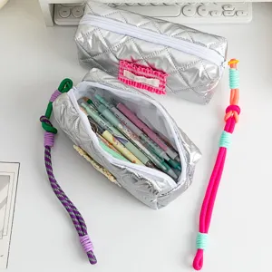 Silver quilted large capacity pencil case with colorful braided rope zipper pulls