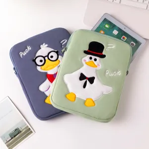 Close-up of cute cartoon duck embroidery on soft padded iPad protective sleeves. (82 chars)