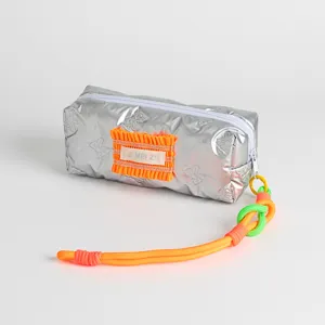 Silver metallic pencil case with neon orange accents and braided rope handle detail