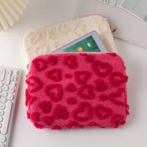 Detailed view of sweet plush iPad sleeve with embossed heart patterns for 11 and 13 inch tablets