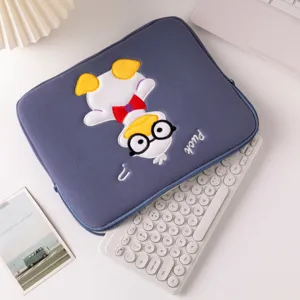Detail of cute duck embroidery on a soft fabric iPad protective sleeve with keyboard