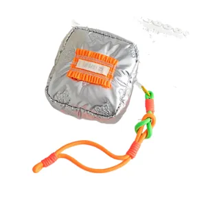 Modern silver puffy PU square cosmetic pouch with orange ruffle and vibrant lanyard